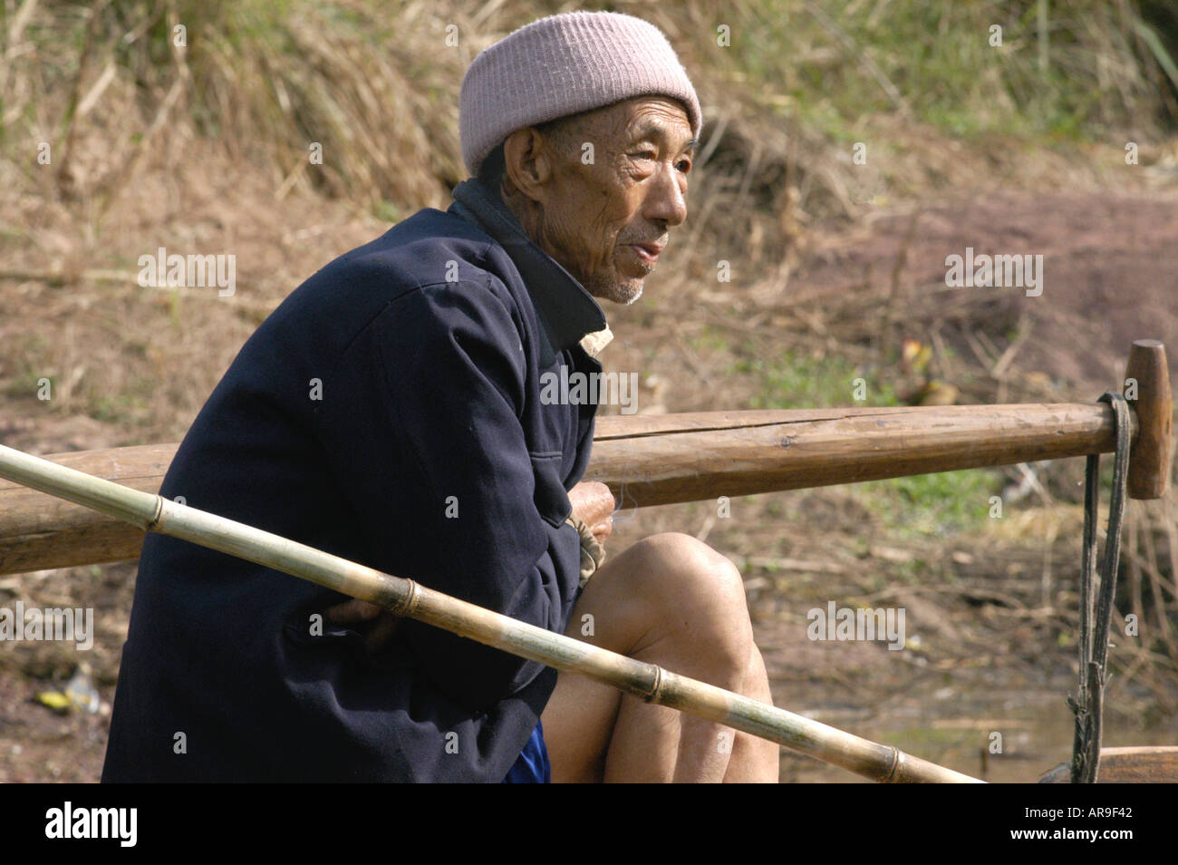 Fisherman on the Shennong River China Stock Photo