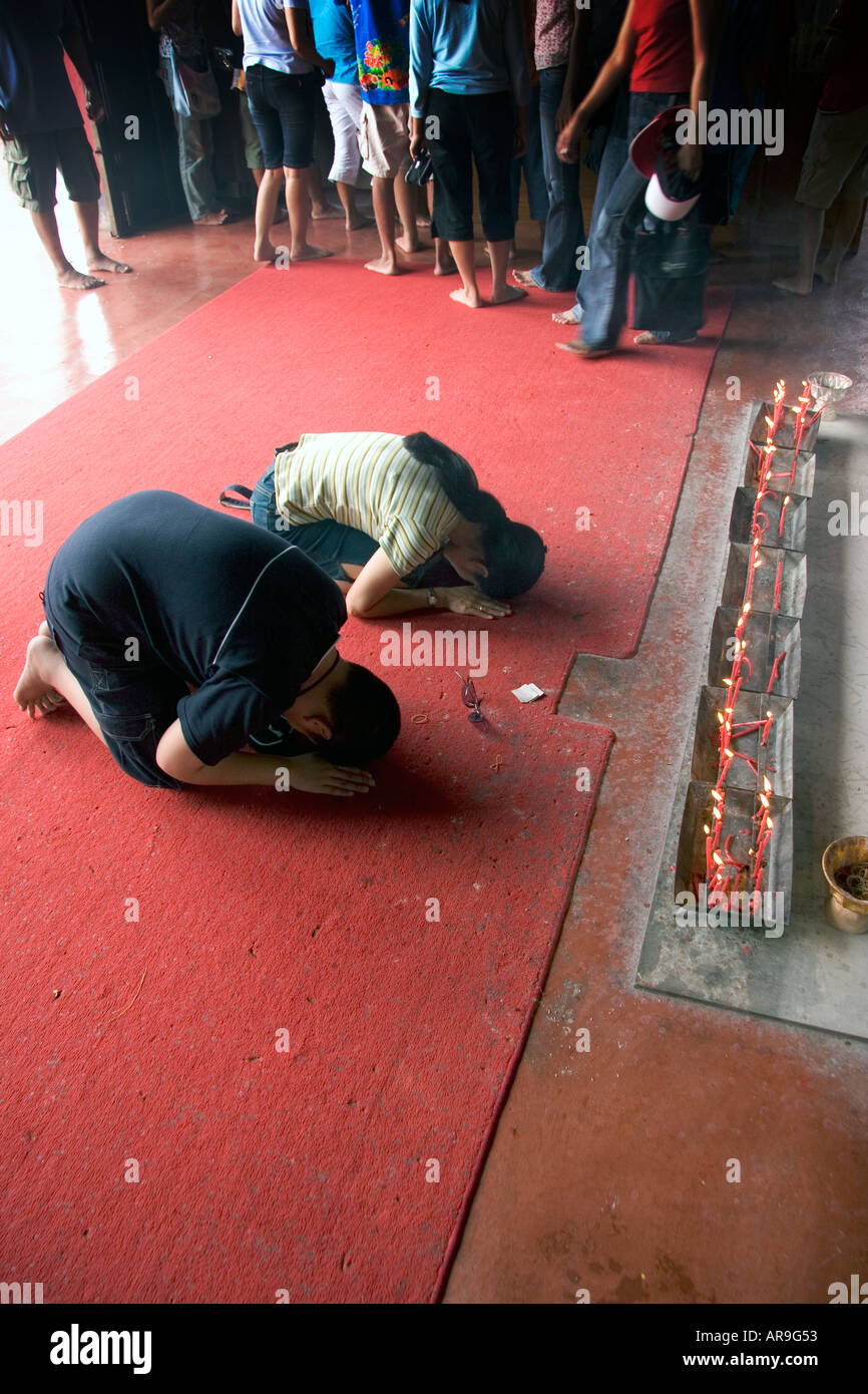 THAI PEOPLE PRAYING AT WAT PHRA THONG, PHUKET, THAILAND Stock Photo
