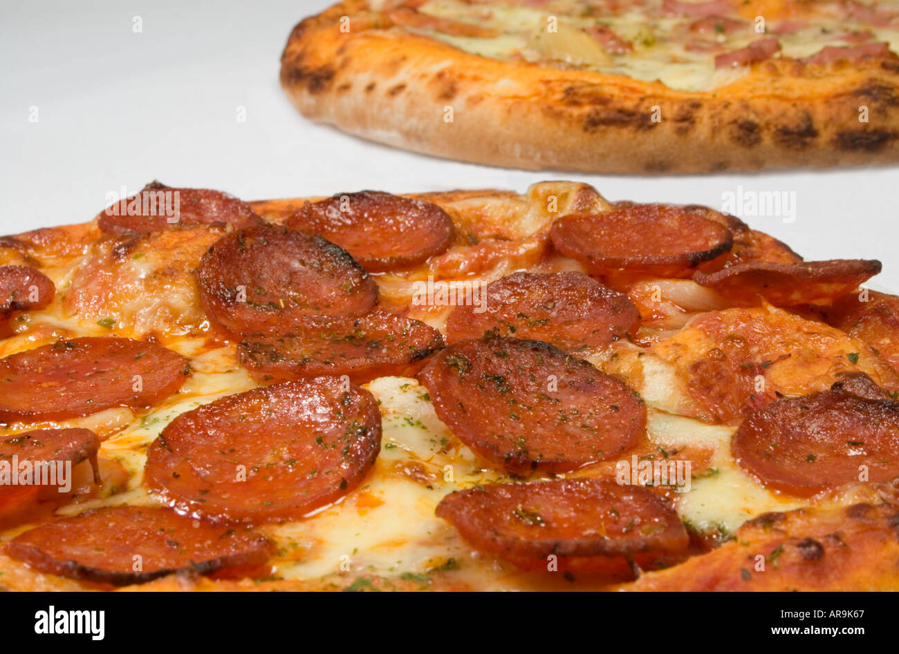 A pepperoni pizza and a ham and pineapple pizza Stock Photo Alamy