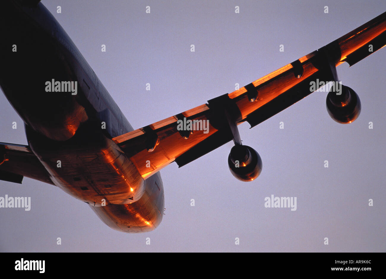 Boeing 747 in the air flying at sunset Stock Photo