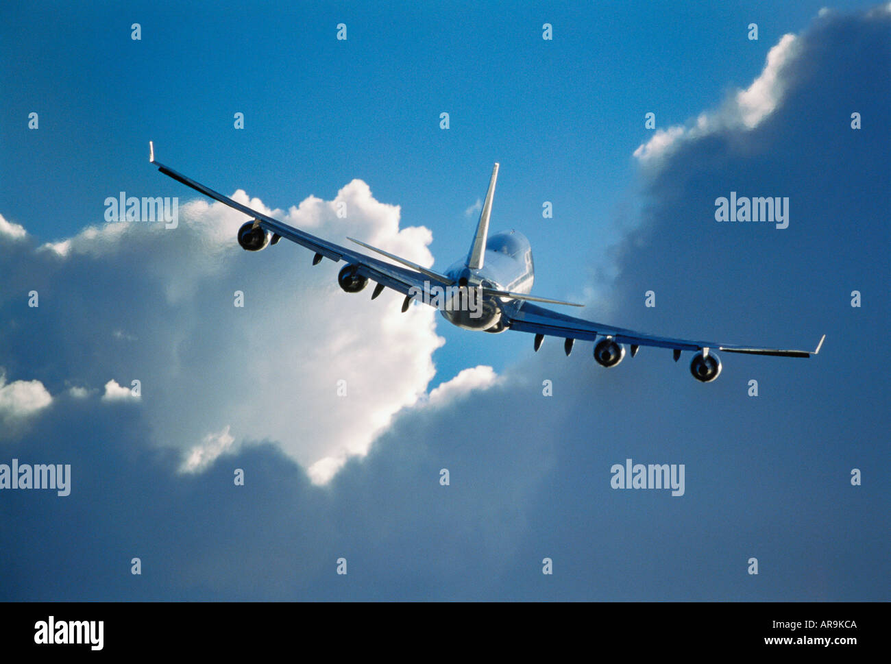 Boeing 747 jumbo jet airliner flying away in the air Stock Photo