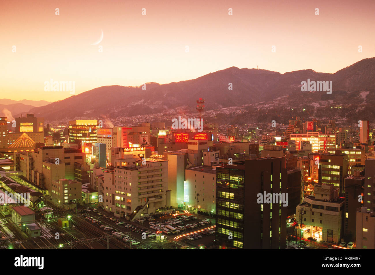 Overview of Nagano and surrounding mountains on Honshu Island in Japan at dusk Stock Photo