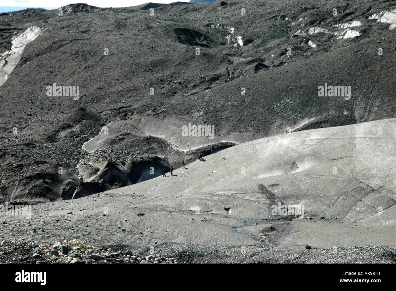 People walking on Root Glacier Kennicott McCarthy Wrangell Saint Elias National Park Alaska Stock Photo