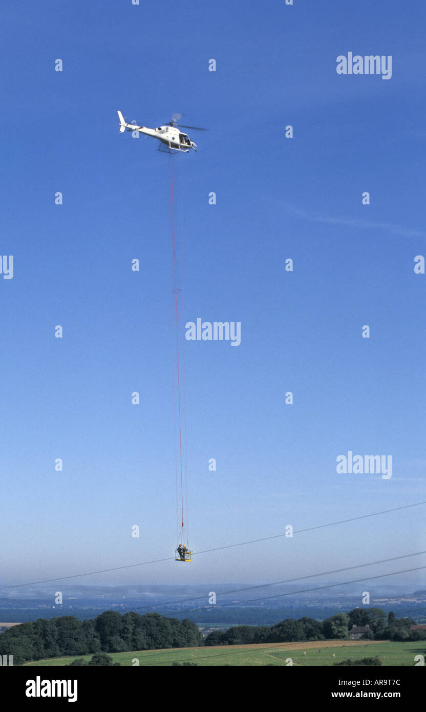 National Grid check power transmission cables with helicopter in south Gloucestershire England Stock Photo