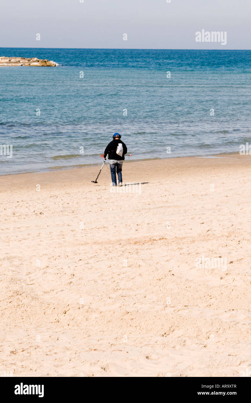 Israel Tel Aviv man with metal detector searching for treasures in the ...