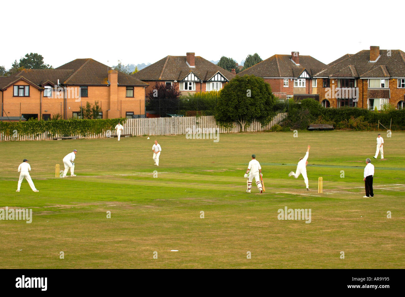 Game in progress at Keynsham Cricket Club village near Bristol England UK Stock Photo