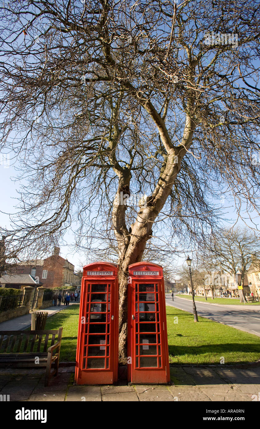 A pair of old red telephone boxes preserved in the Worcestershire village of Broadway England UK Stock Photo