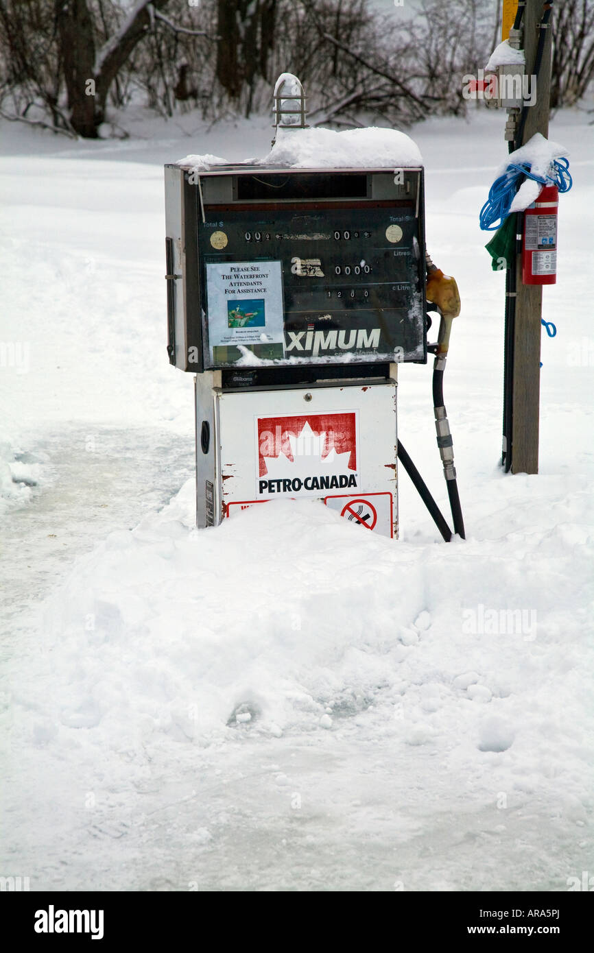 frozen gas station in the Winter with lots of ice and snow Stock Photo