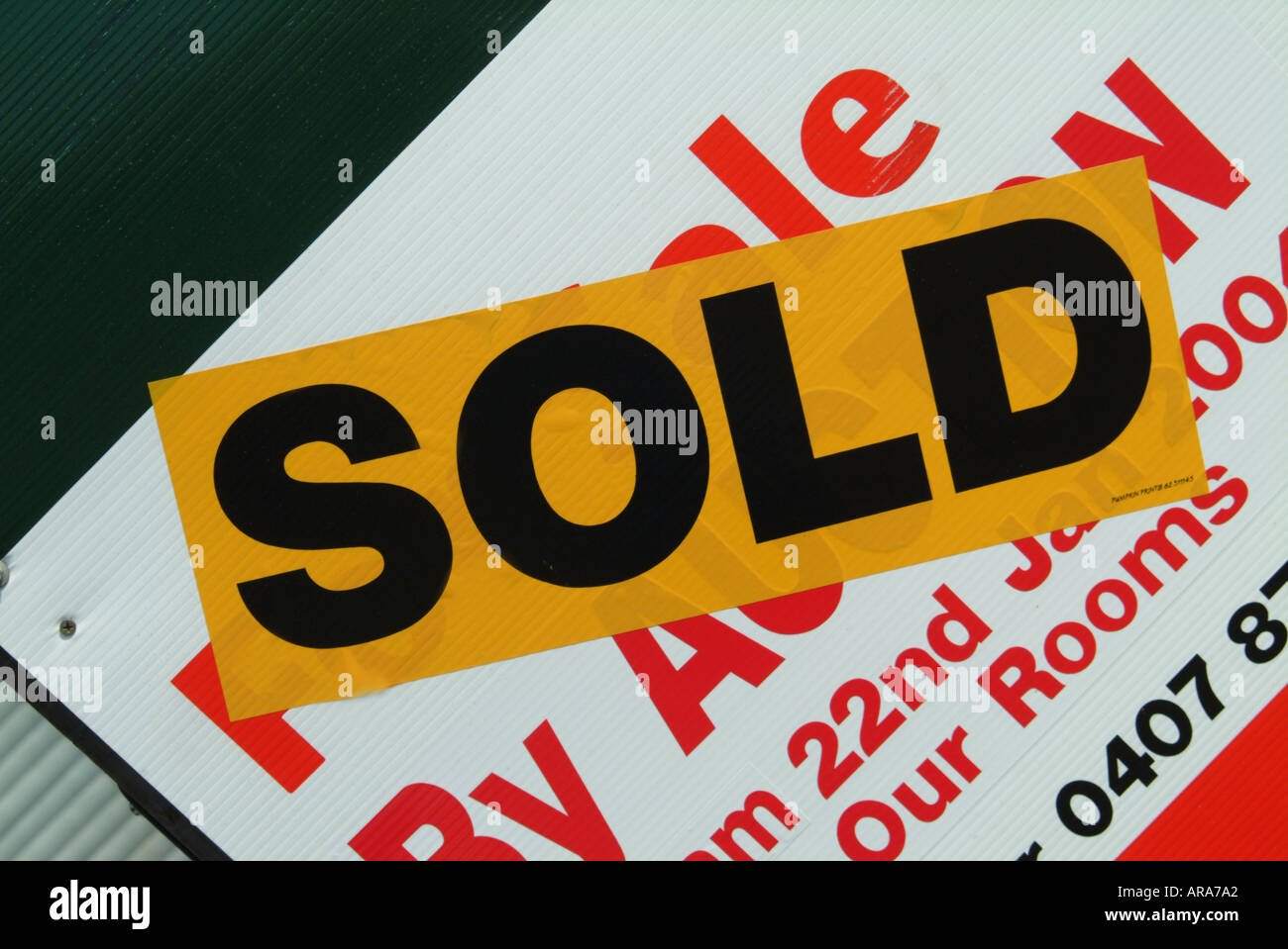 Real estate agent s sold sign Stock Photo - Alamy