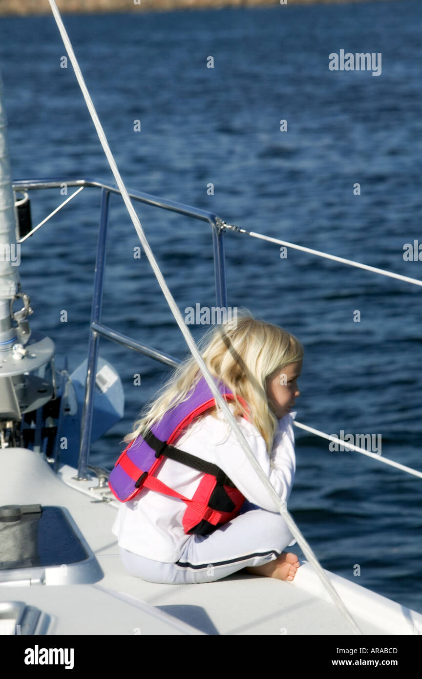 little girl sitting on sailboat Stock Photo Alamy