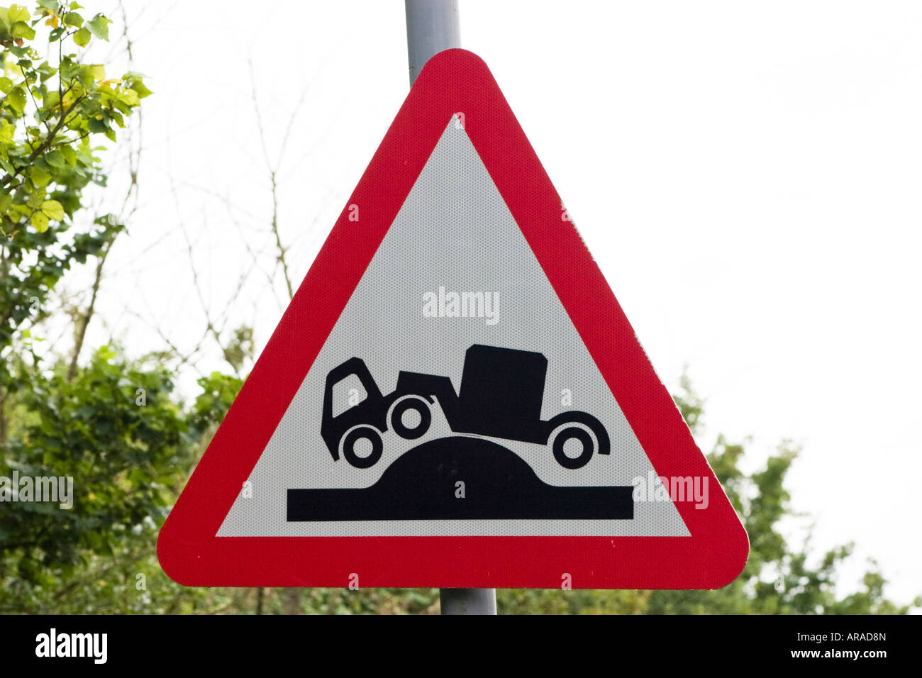 Caution risk of grounding ahead road sign Stock Photo