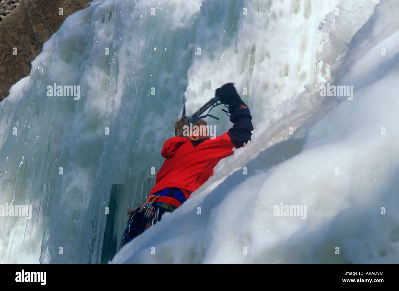 Ice climbers on rocky Mountain ice Stock Photo Alamy
