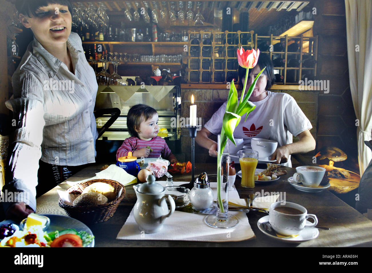 mother daughter waitress surreal cafe culture vivid dreamlike breakfast service germany idyllic happy positive morning Stock Photo