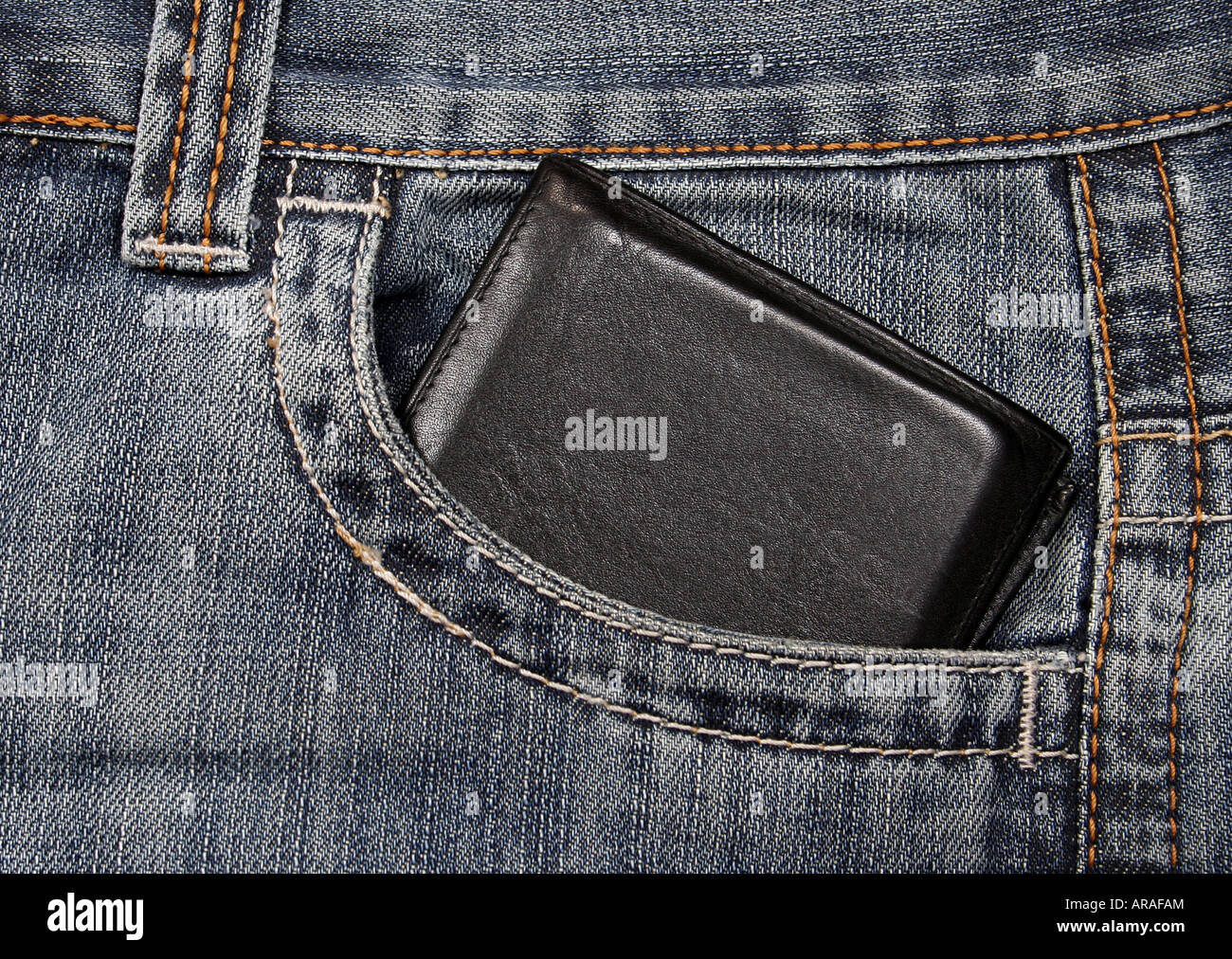 black wallet in a jeans pocket Stock Photo