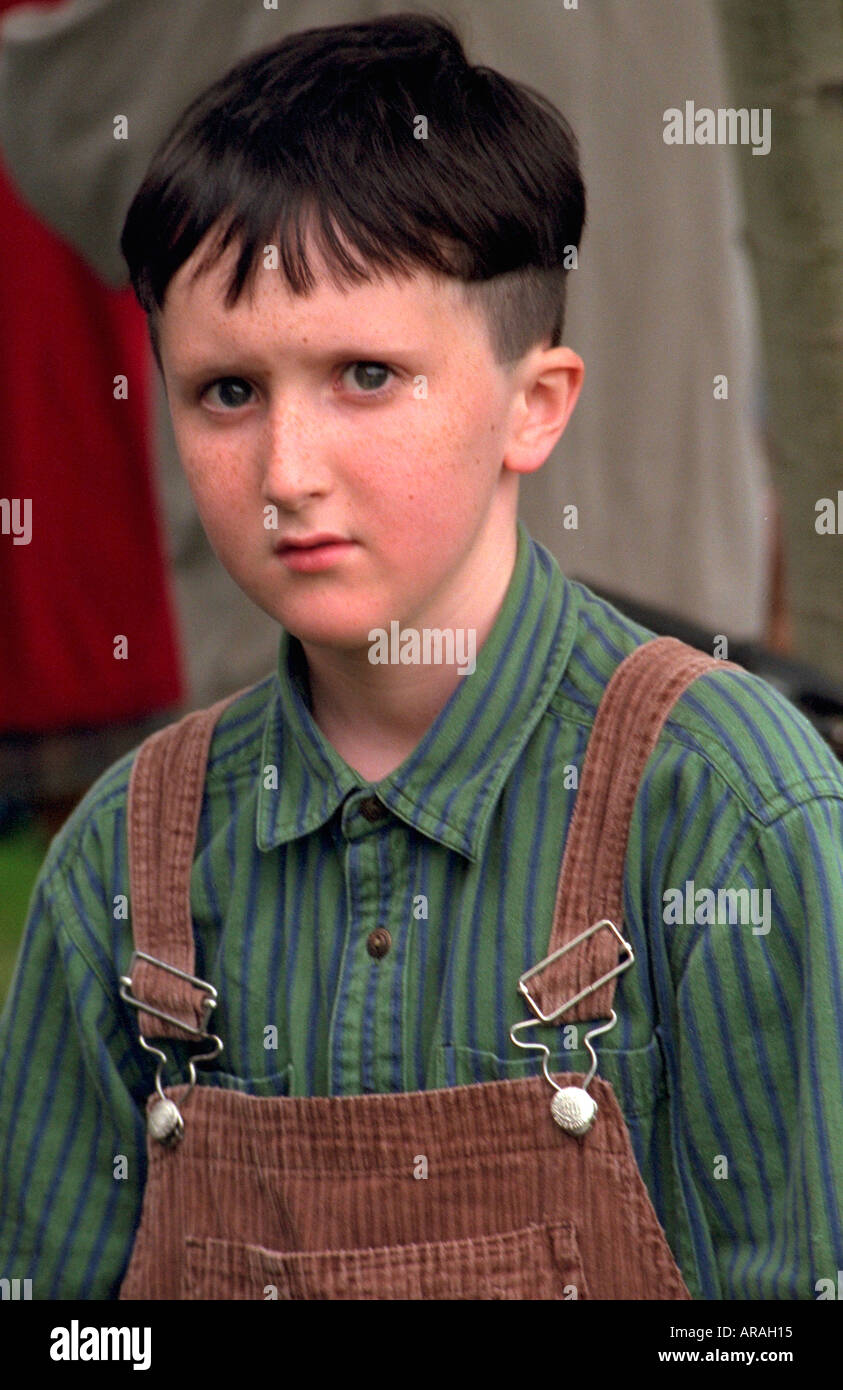 Boy age 11 in bib overalls looking serious at Memorial Day service. St Paul  Minnesota MN USA Stock Photo - Alamy