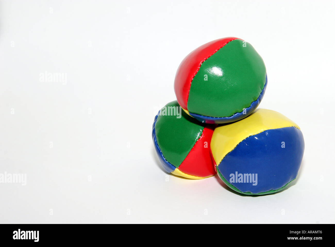 Juggling balls stacked on white background colored group Stock Photo