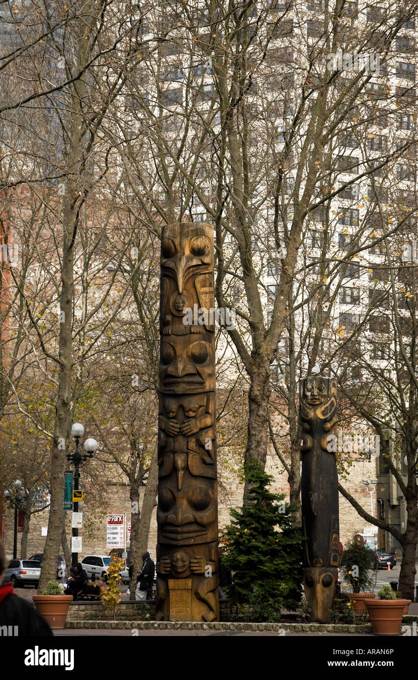 Native American totem poles in Occidental Square Park Seattle Washington Stock Photo