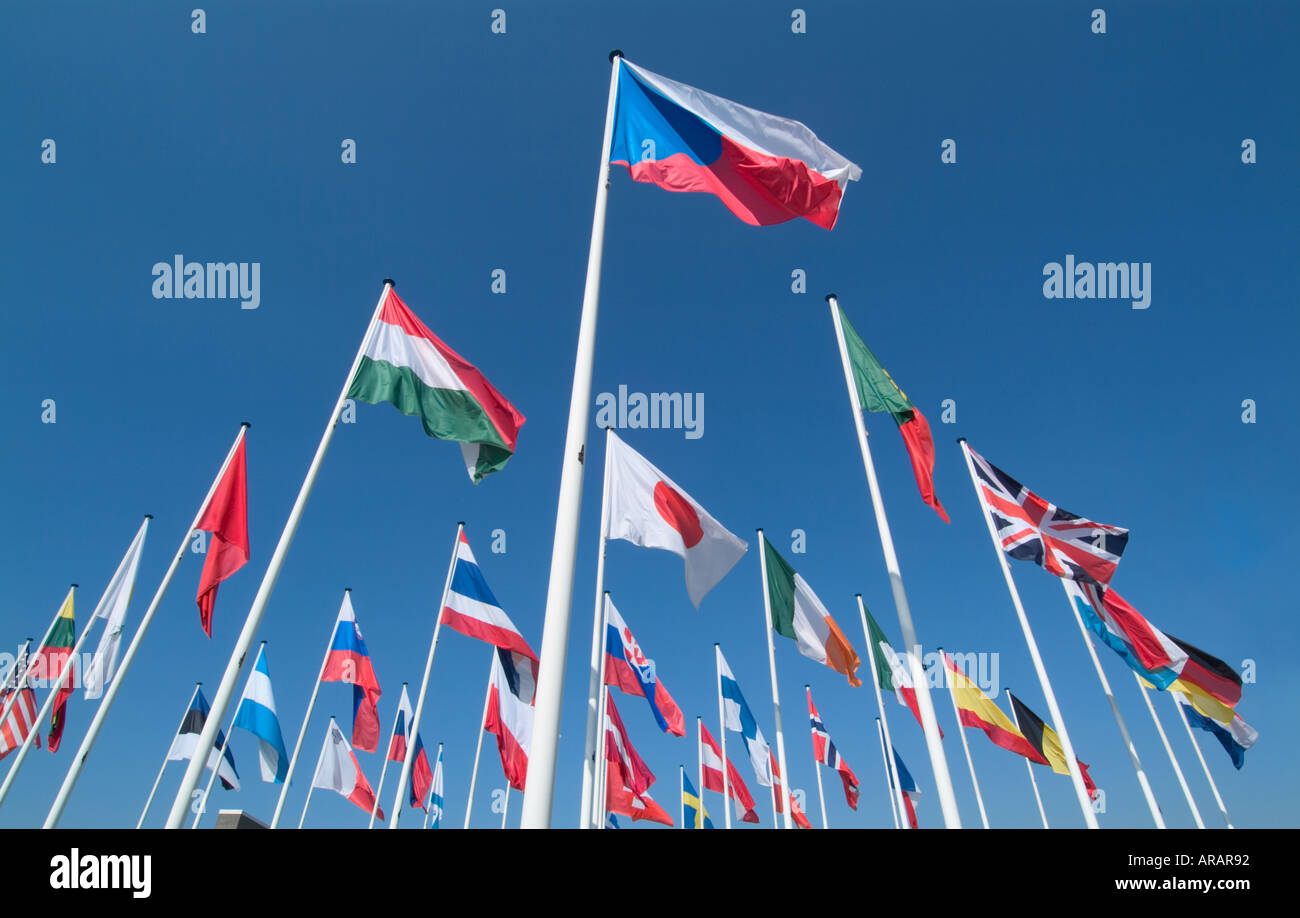 international flags flying against a blue sky Stock Photo