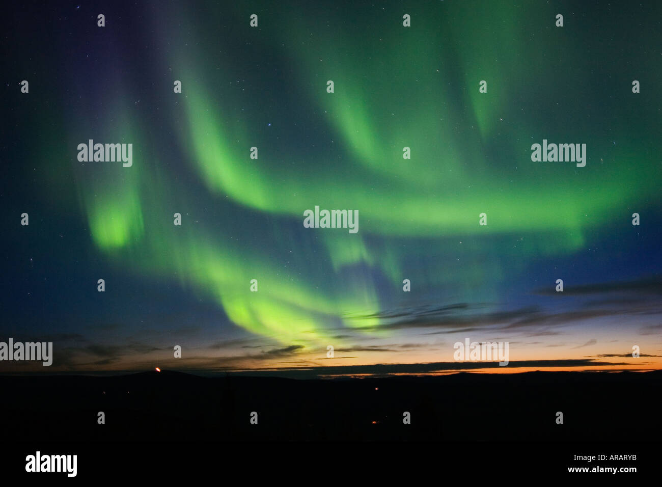 Twilight sky filled with northern lights Stock Photo