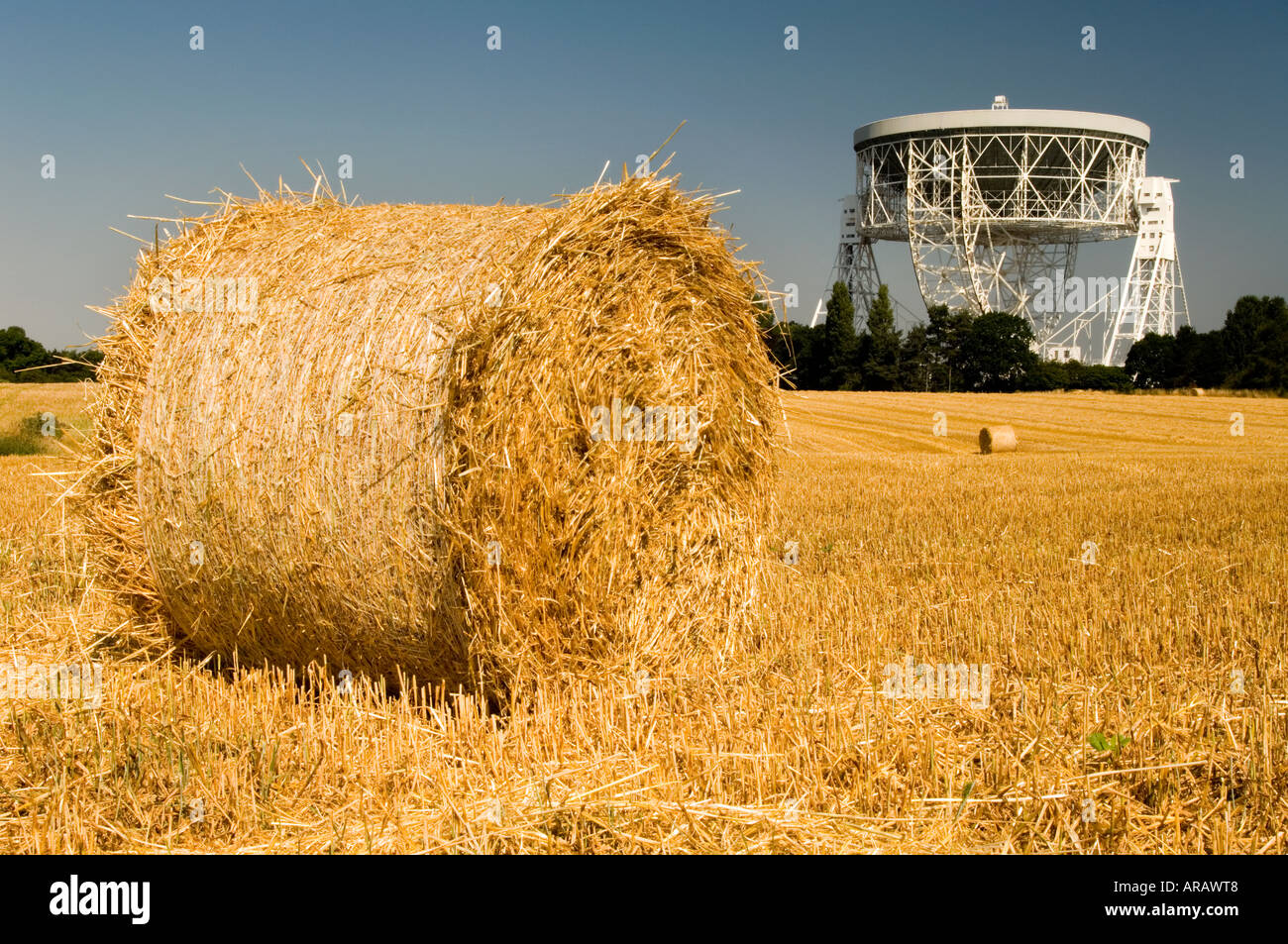 The Giant Mk1A Jodrell Bank Radio Telescope and Round Harvested Hay Bales, Near Holmes Chapel, Cheshire, England, UK Stock Photo