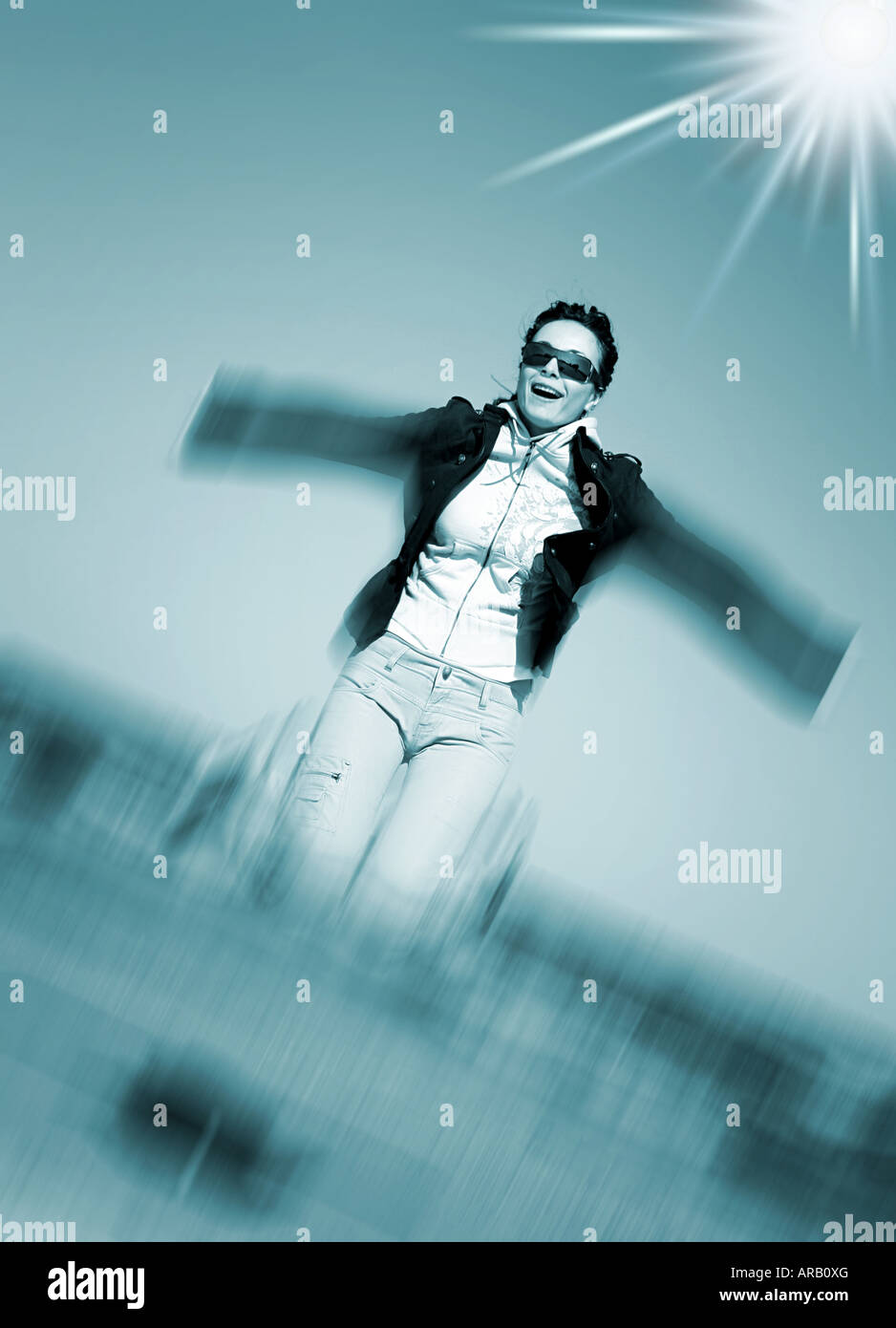 Young woman jumping against blue sky Stock Photo - Alamy
