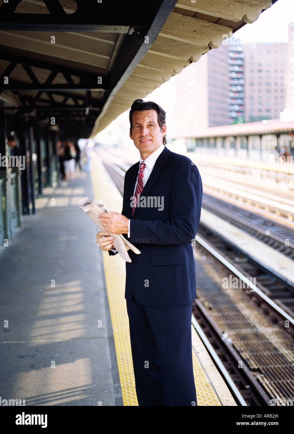 Lone man waiting train station hi-res stock photography and images - Alamy