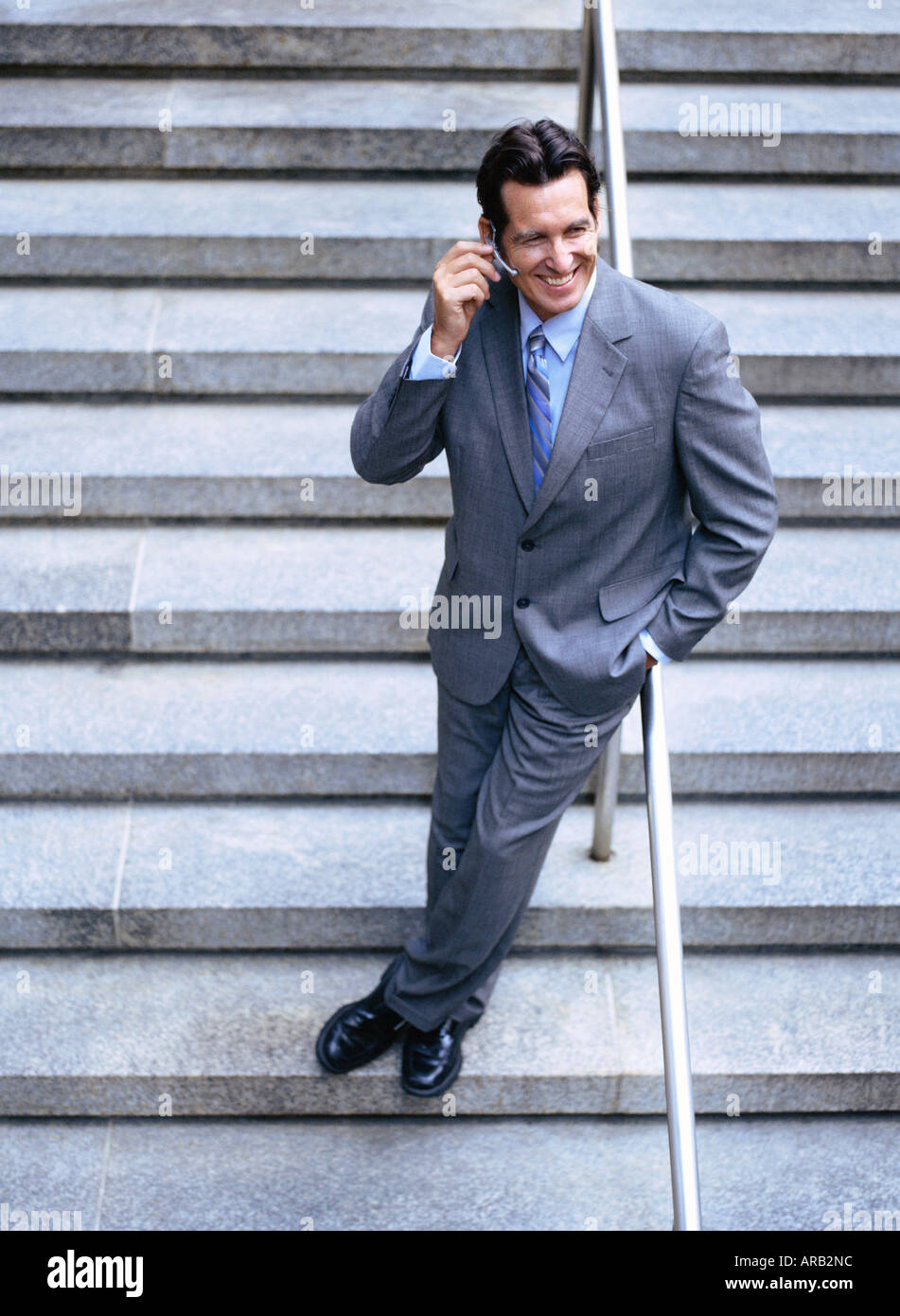 Portrait of Businessman Using Cellular Telephone Stock Photo