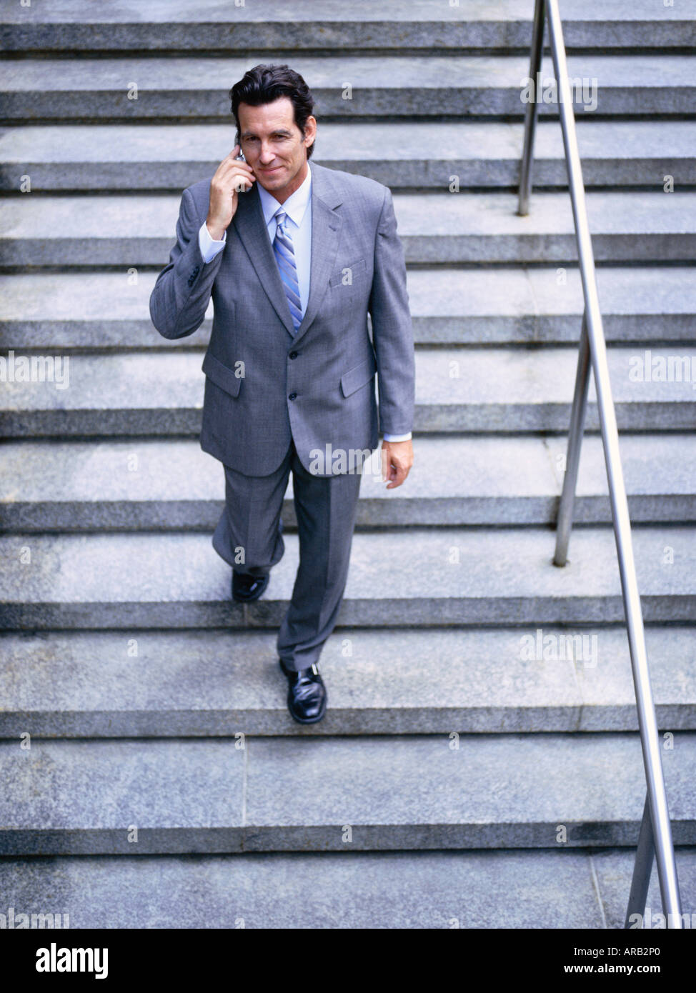 Portrait of Businessman Using Cellular Telephone Stock Photo