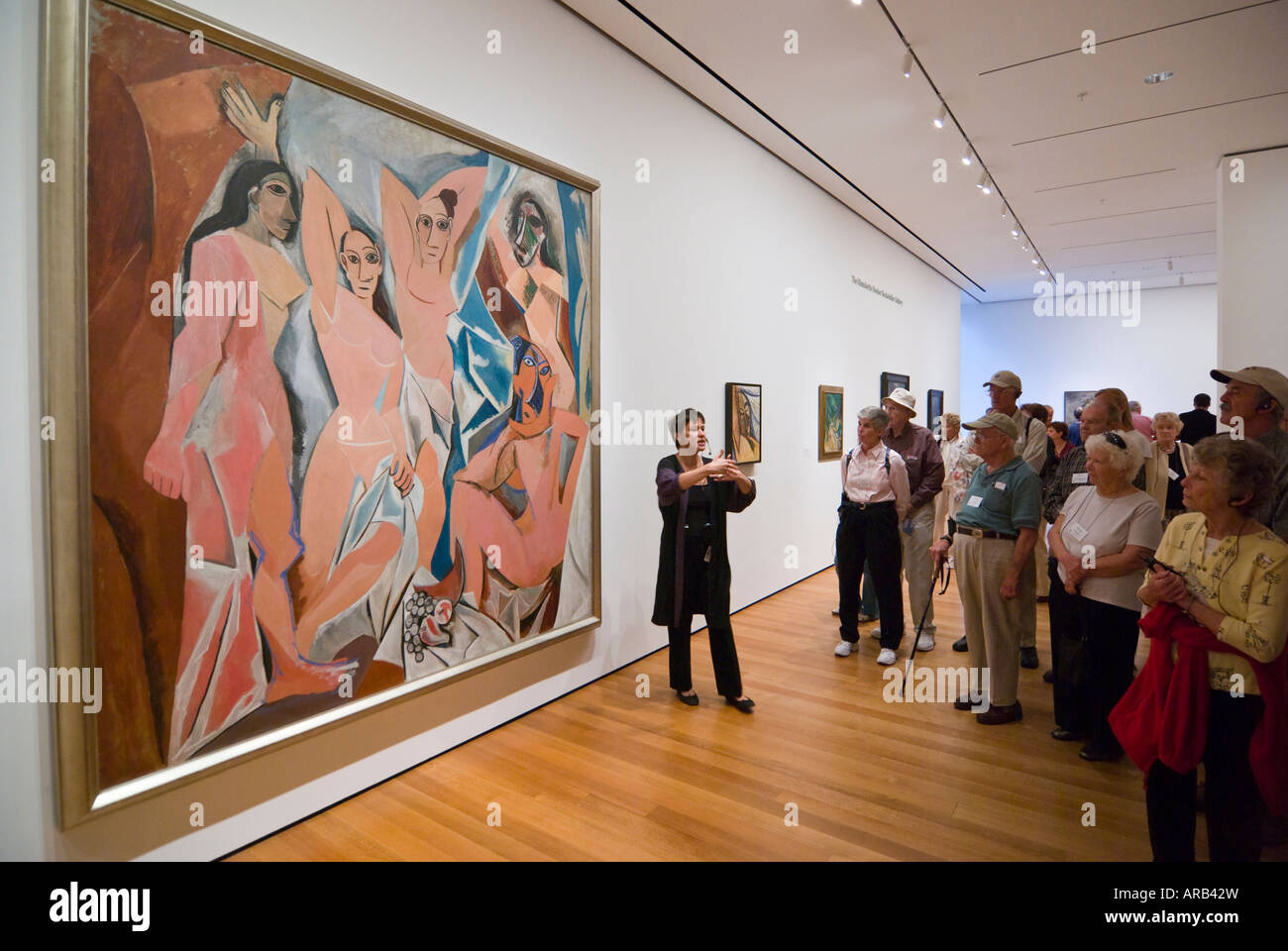 lecturer in front of Les Demoiselles d'Avignon by Picasso, The Museum of Modern Art, New York Stock Photo