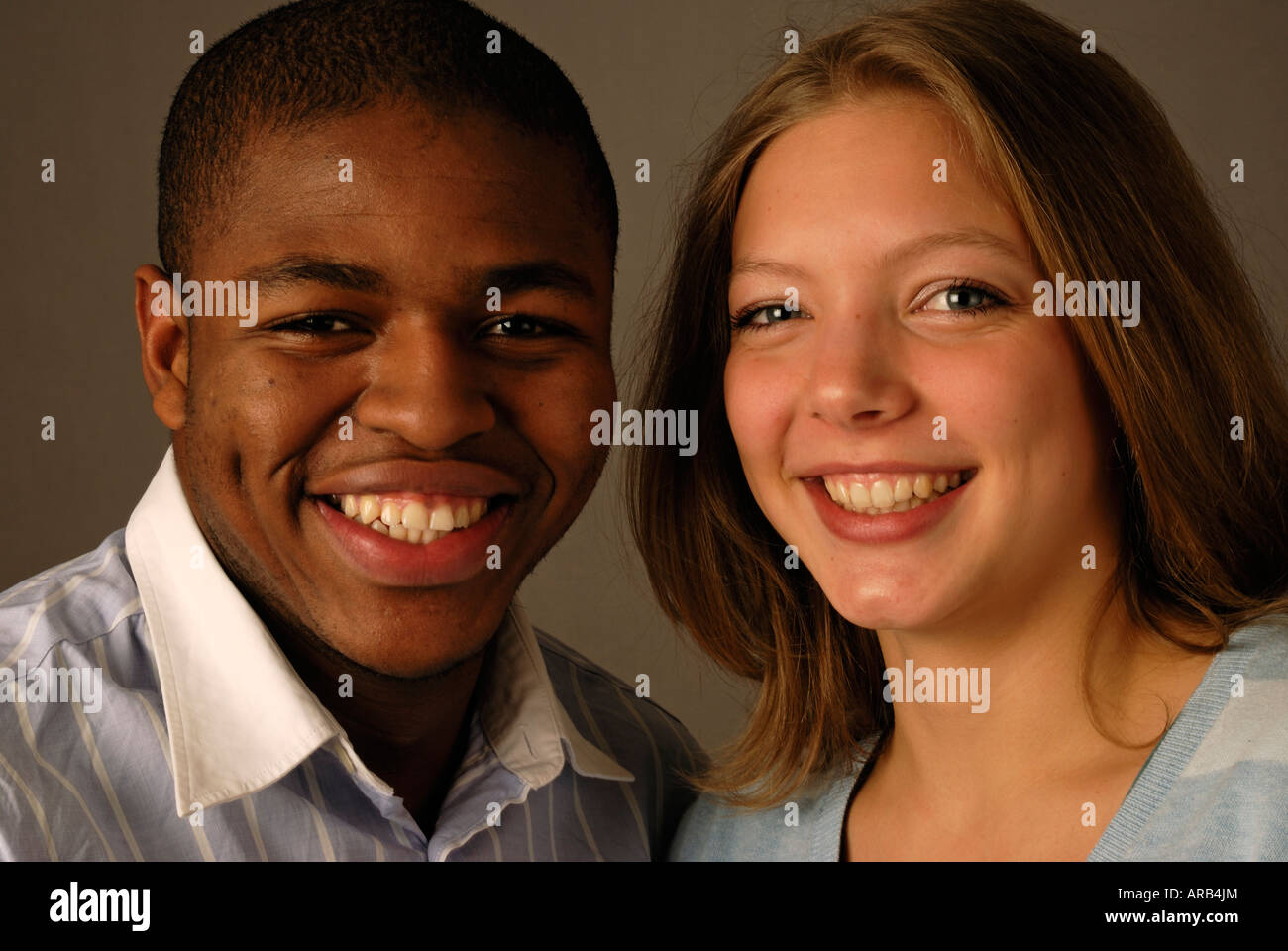 Smiling and laughing young mixed rade couple. Stock Photo