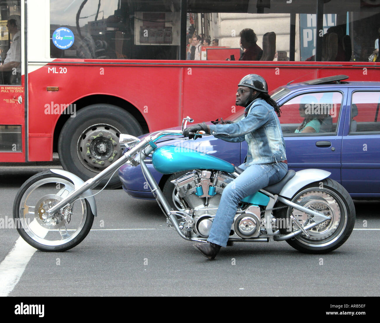 a biker on a modified chopper bike  in London Stock Photo