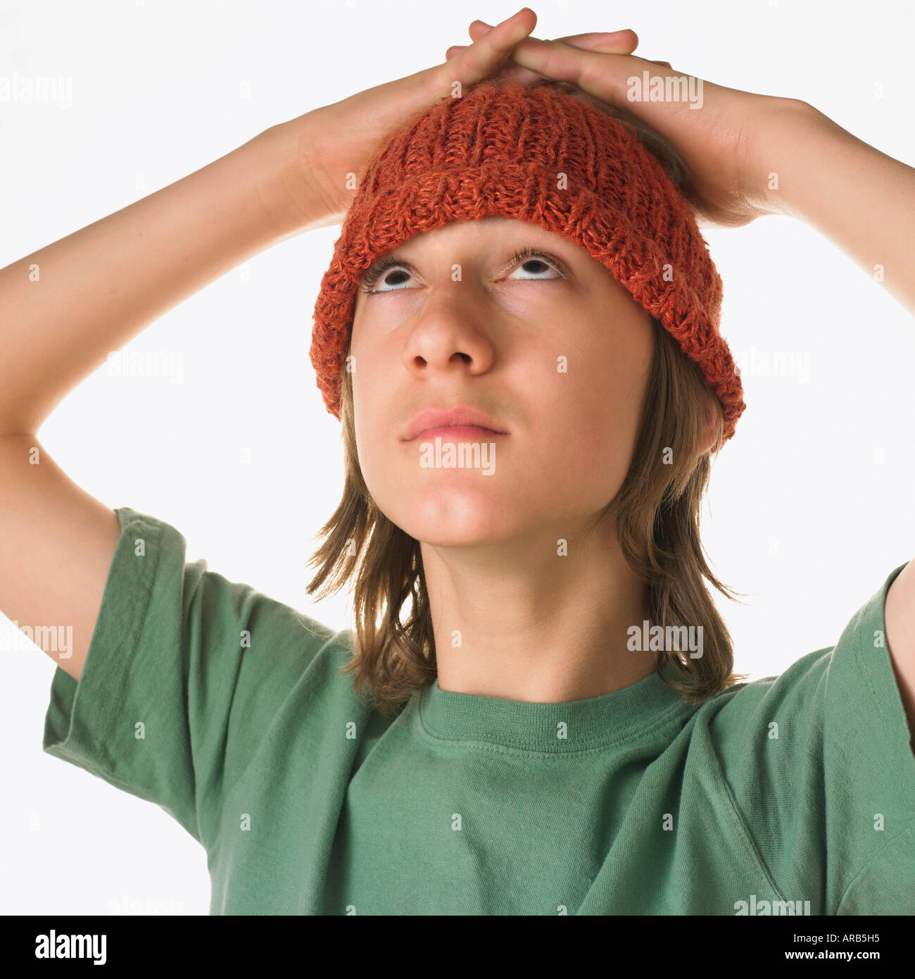 Teenaged Boy With Hands on Head Stock Photo