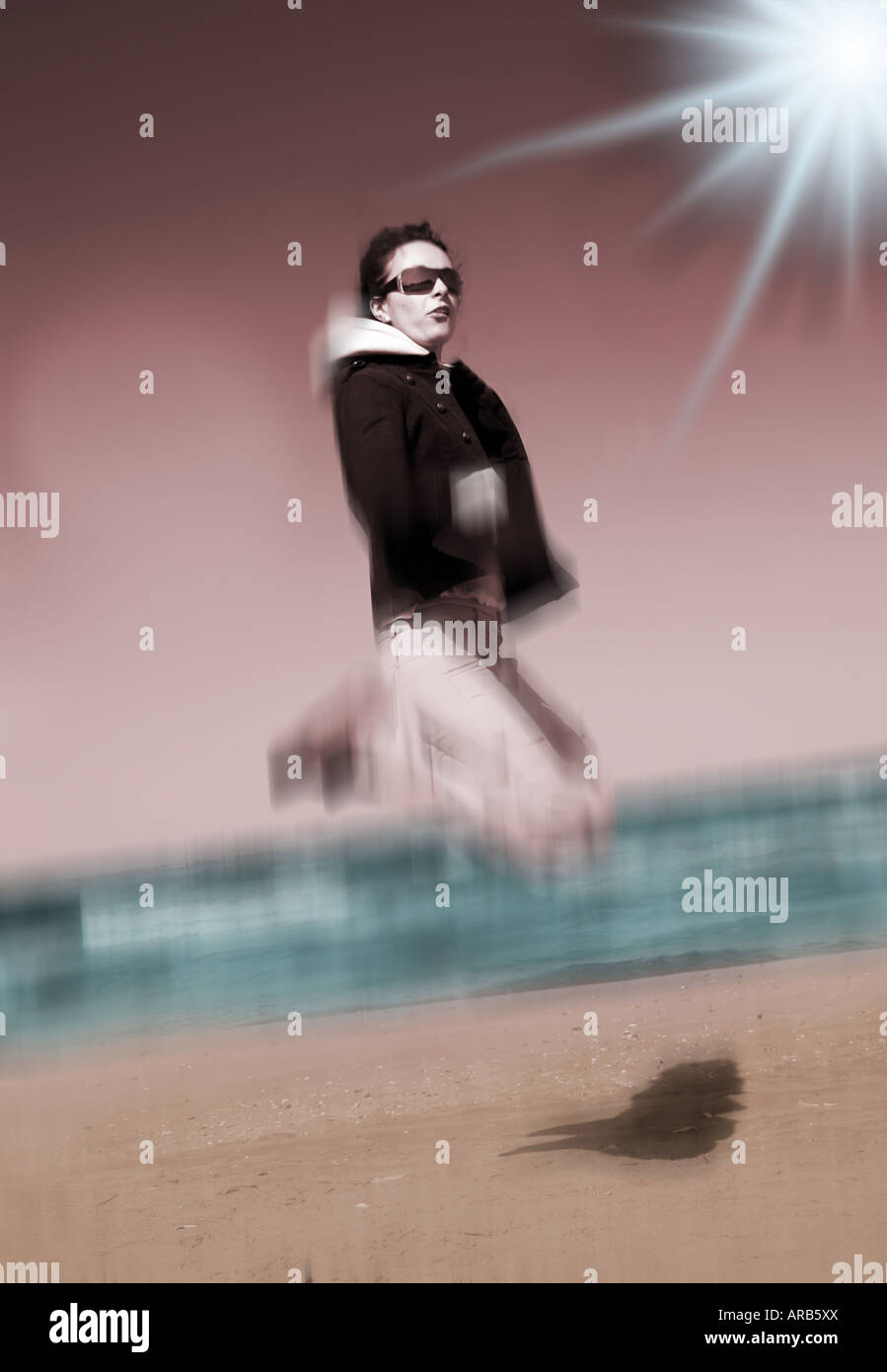 Young woman jumping against blue sky Stock Photo - Alamy