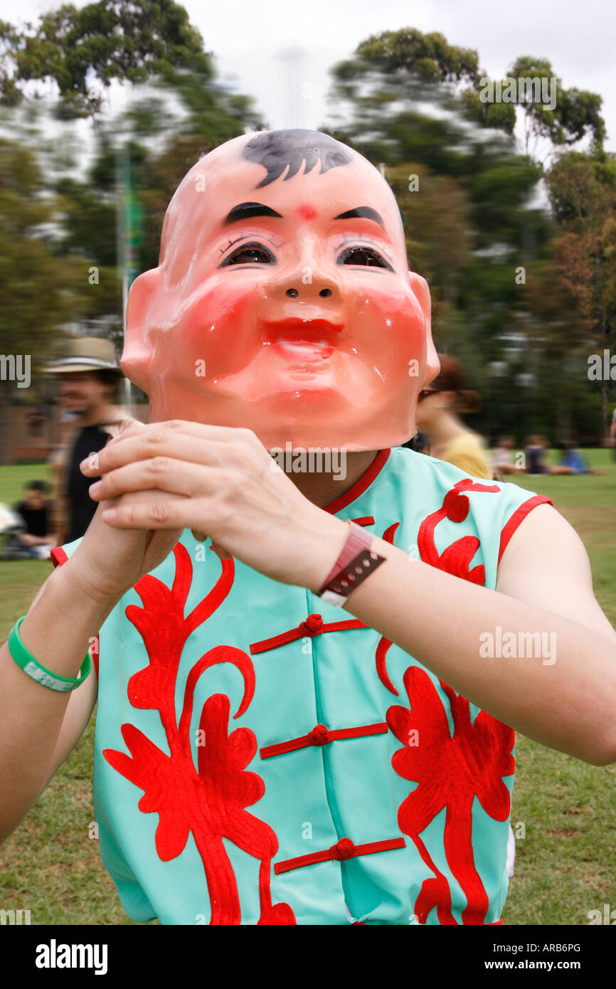 Man in Big Head Buddha Mask Stock Photo