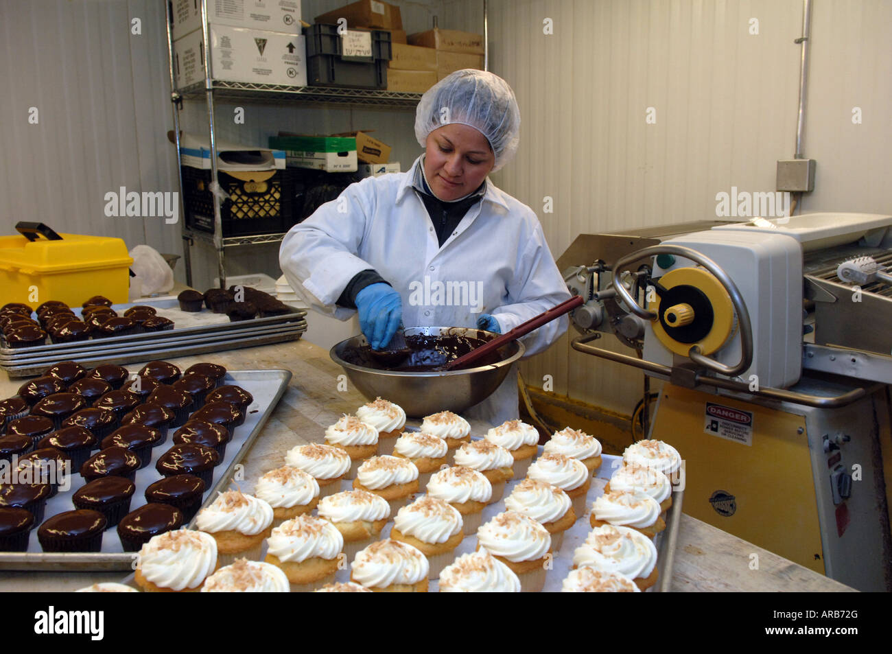Cupcakes at frosted at Fresh Direct s Queens New York processing plant Stock Photo