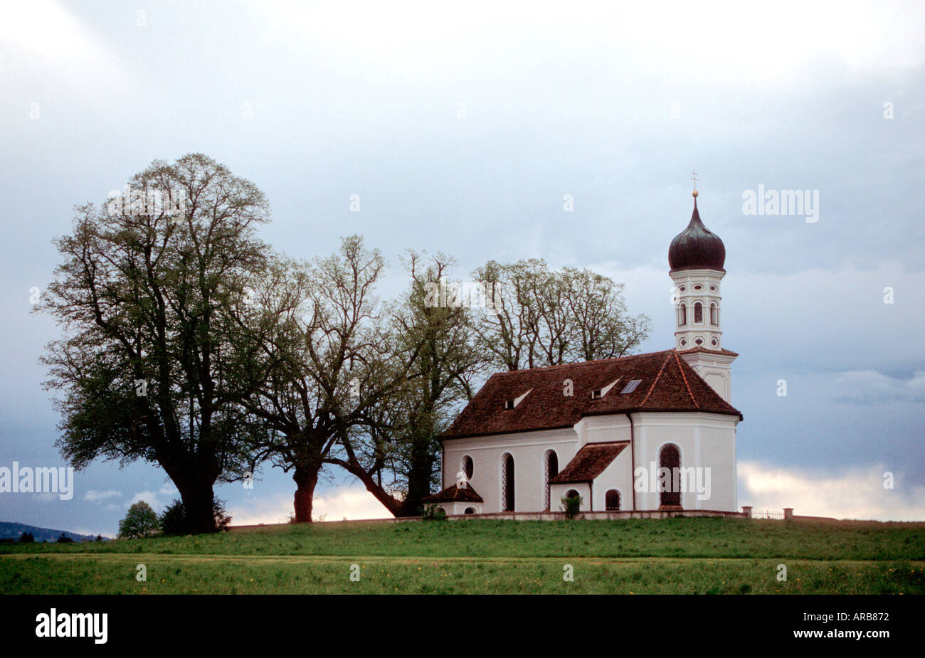 St Andrae a typical Bavarian church standing solitaire at Etting near Polling  Weilheim-Schongau district  Bavaria Germany Stock Photo