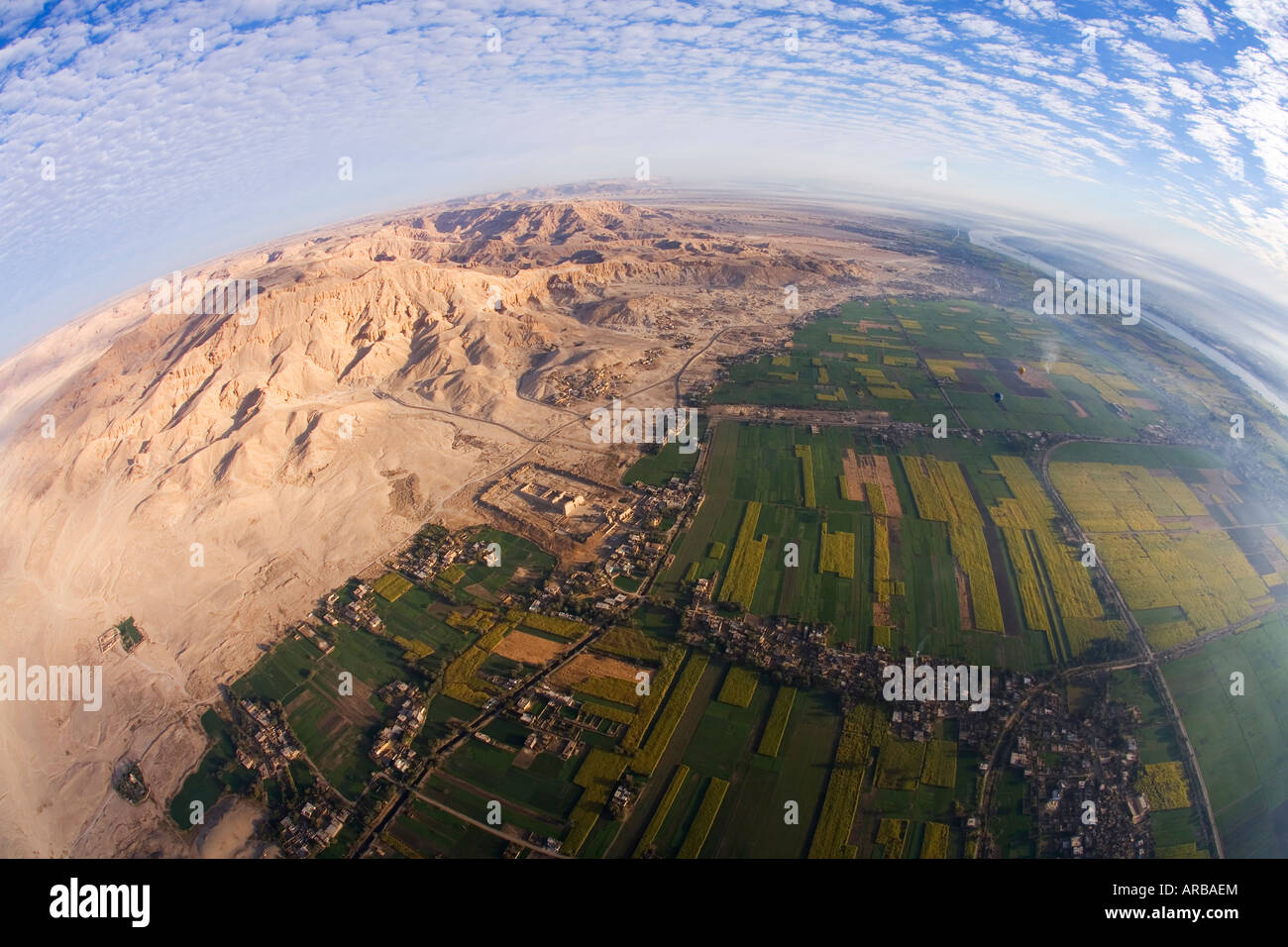 View from hot-air hot air balloon ride above Valley of the Kings and Nile river Luxor Egypt North Africa Stock Photo