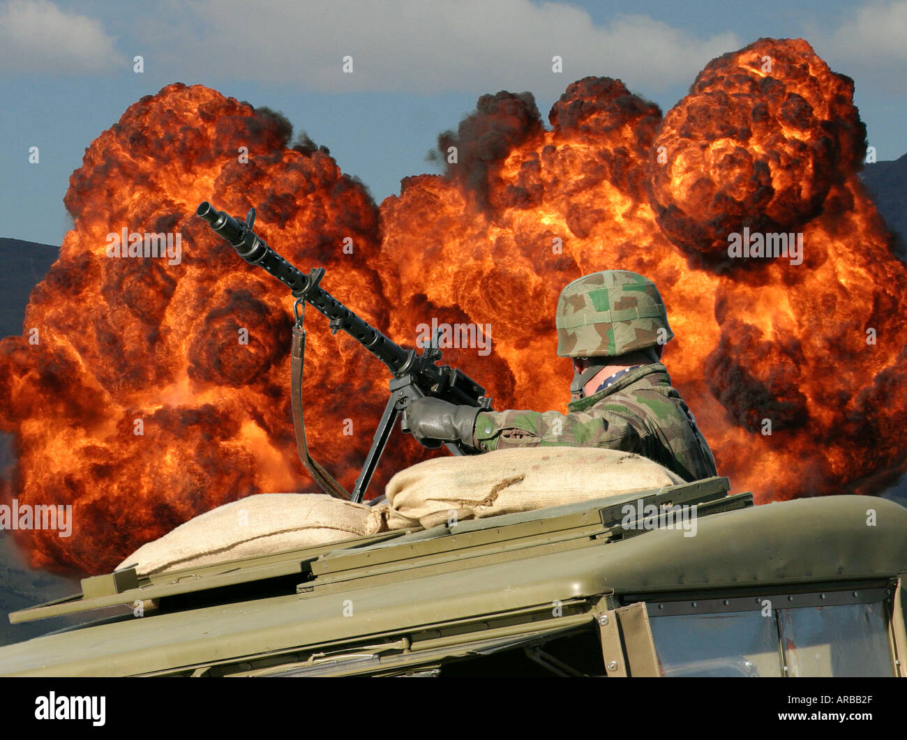 World War II Soldier machine gun and explosion Stock Photo