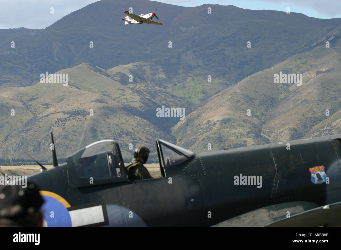 Goodyear Corsair FG 1D whispering death fighter bomber and Mustang in distance Stock Photo
