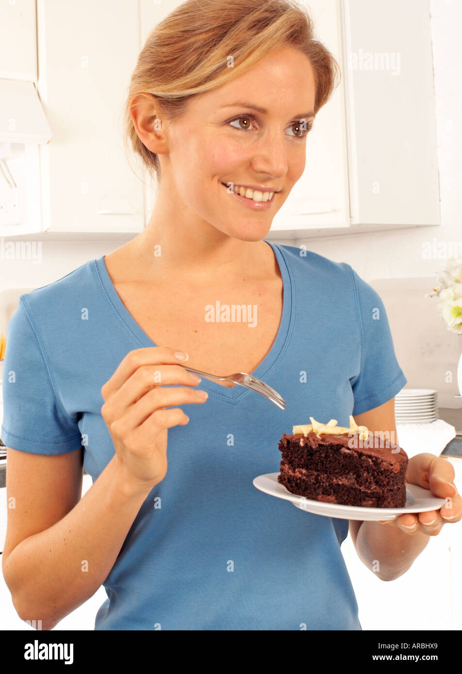 WOMAN EATING CHOCOLATE CAKE Stock Photo Alamy