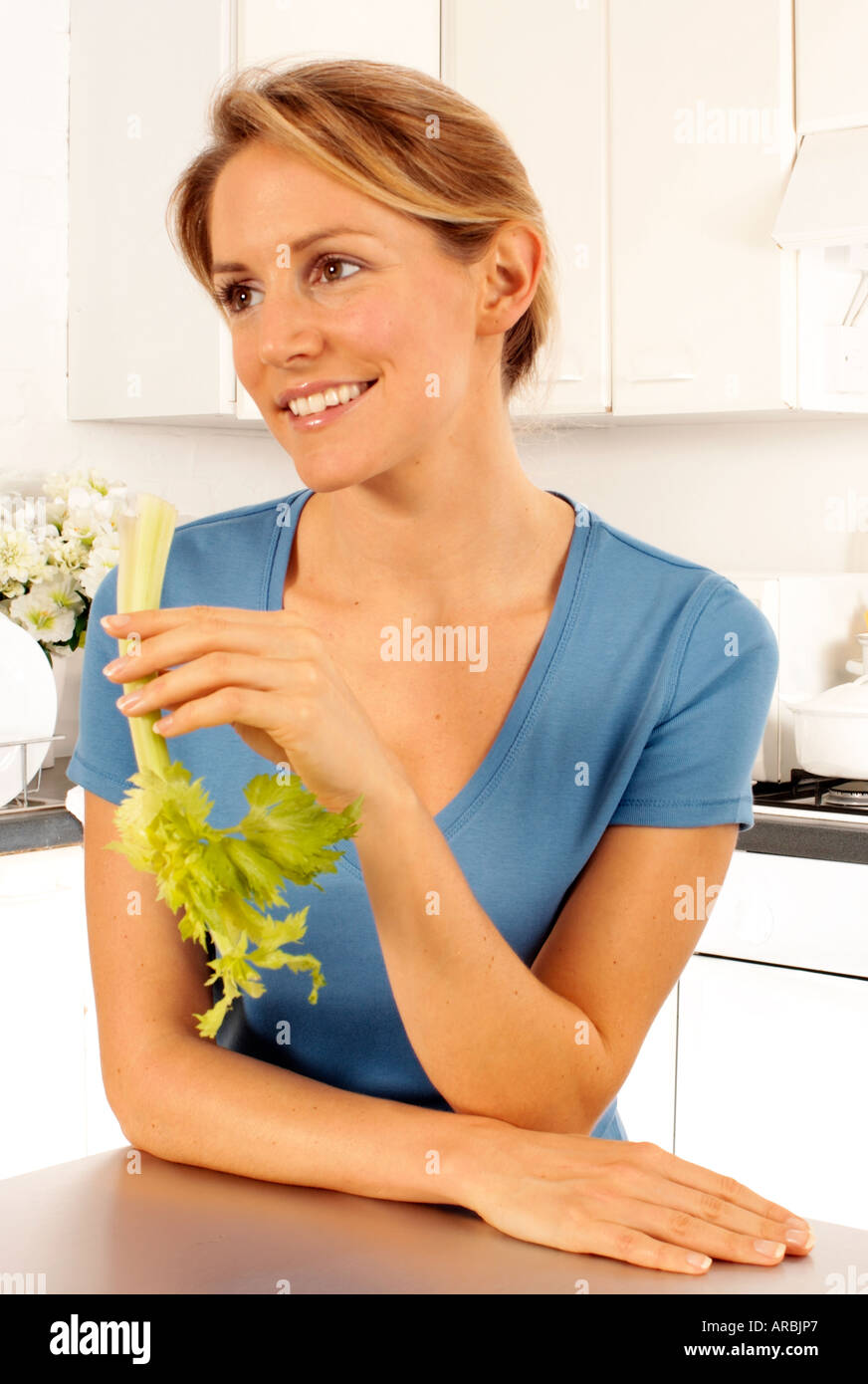 GIRL EATING CELERY Stock Photo Alamy