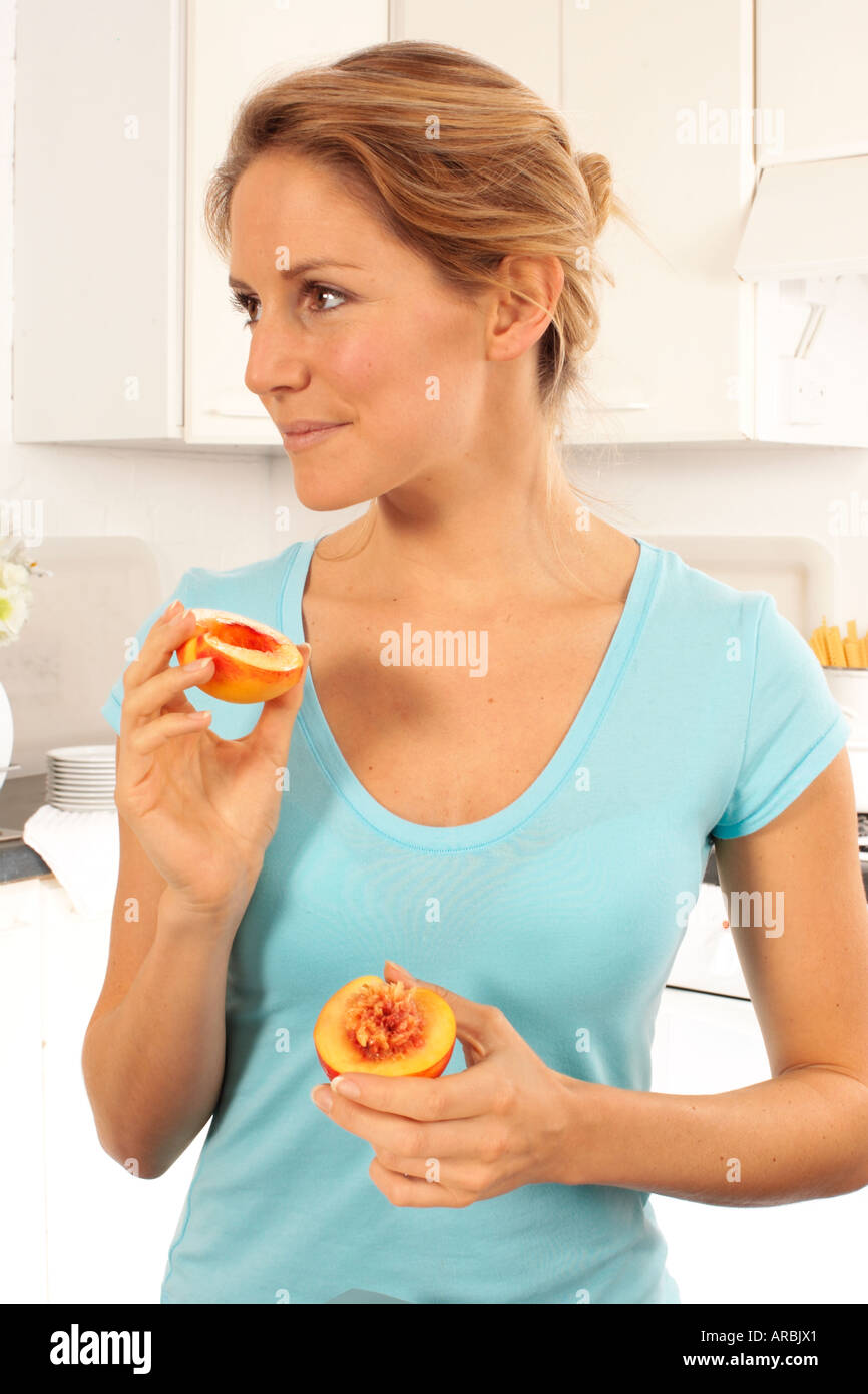 GIRL EATING NECTARINES Stock Photo Alamy