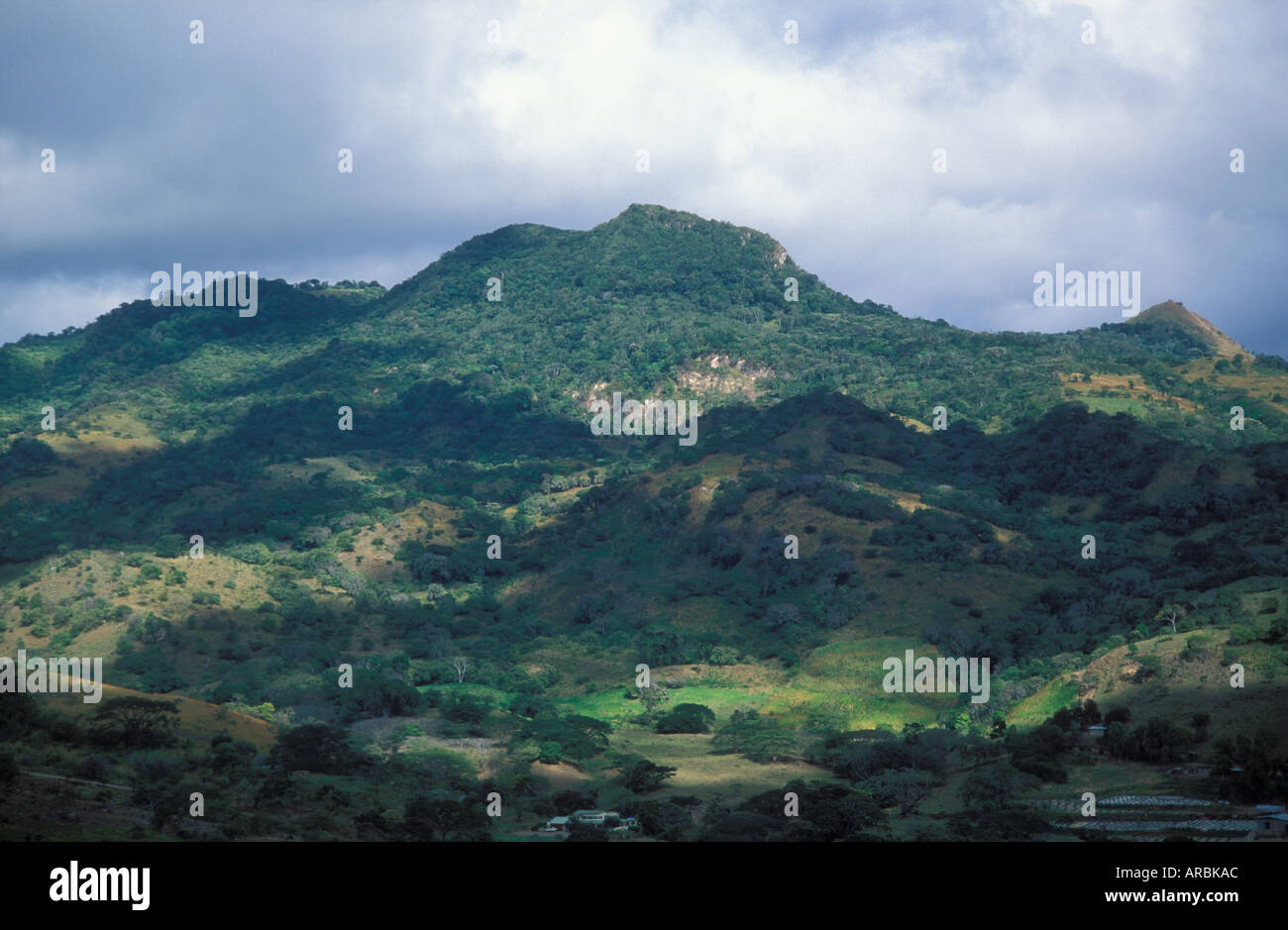 Forested Mountains and cleared agricultural land in mountains along road between Matagalpa and Jinotega Nicaragua Stock Photo