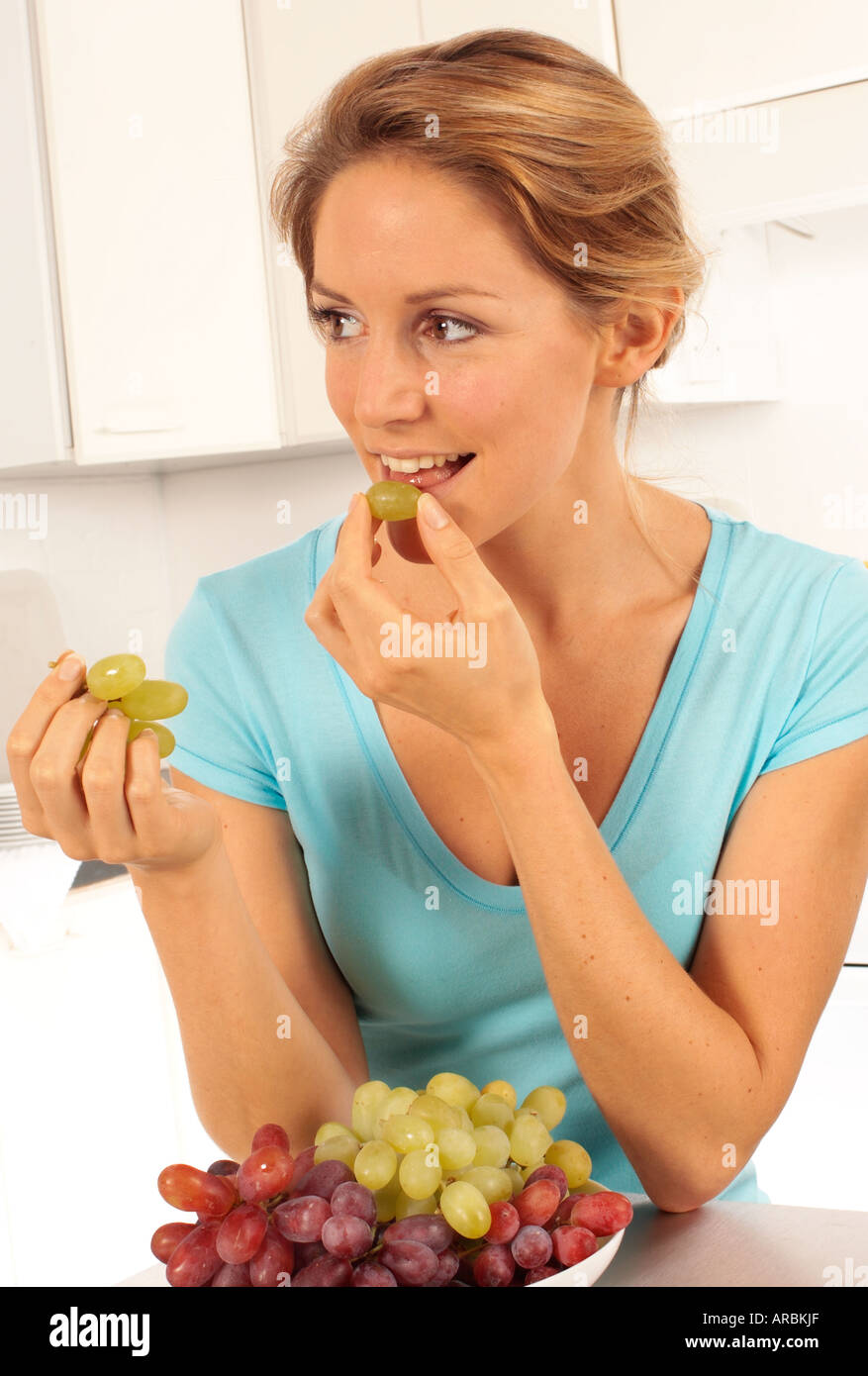 GIRL EATING GRAPES Stock Photo Alamy