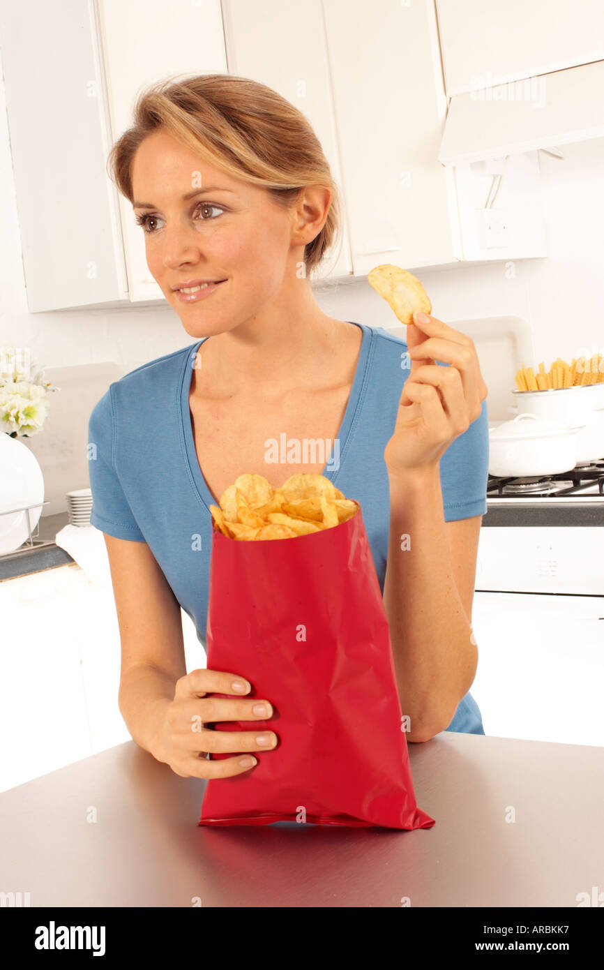 Girl eating potato crisps hires stock photography and images Alamy