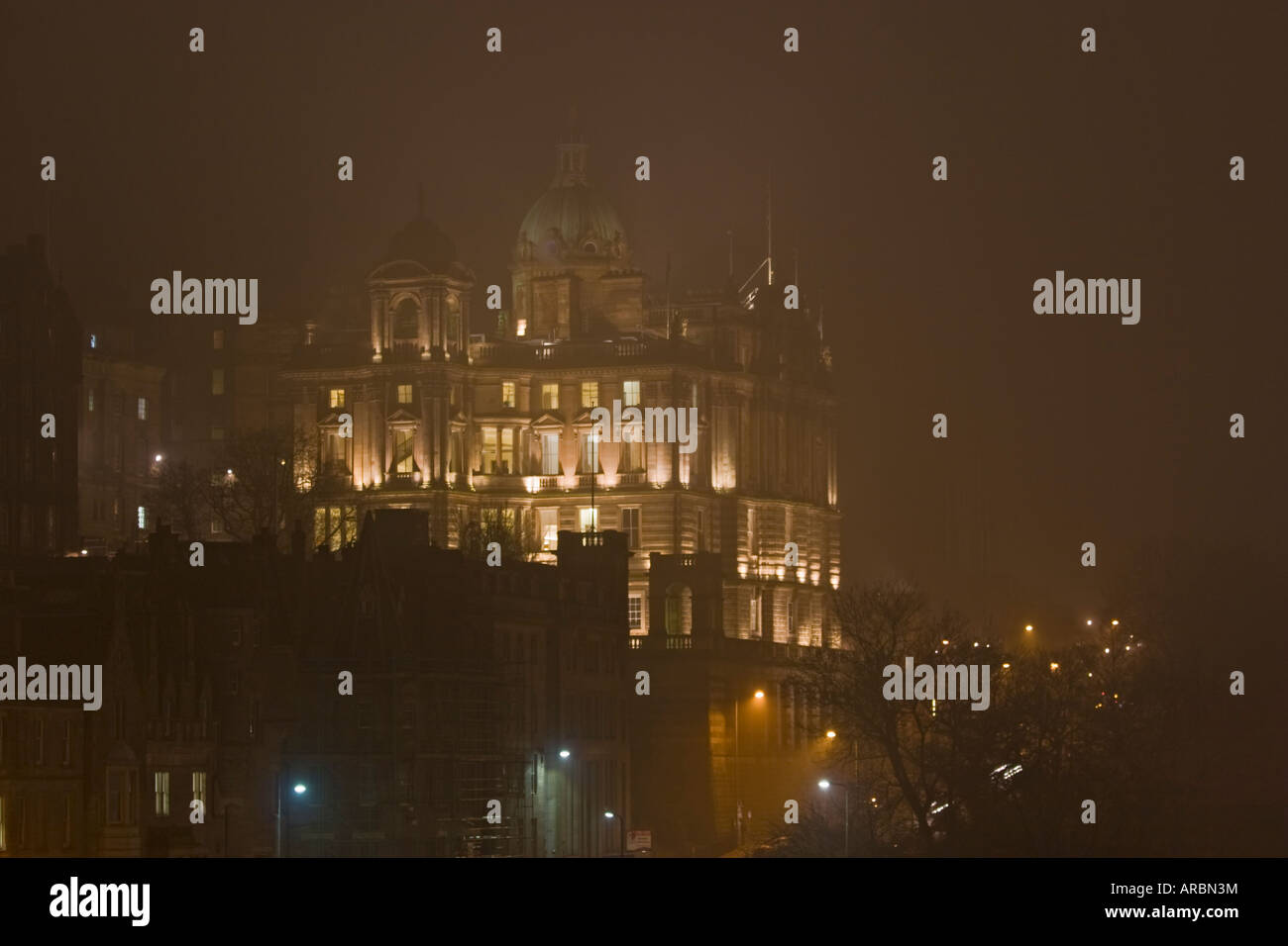 Bank of Scotland building in Edinburgh through the fog at night, from North Bridge Stock Photo