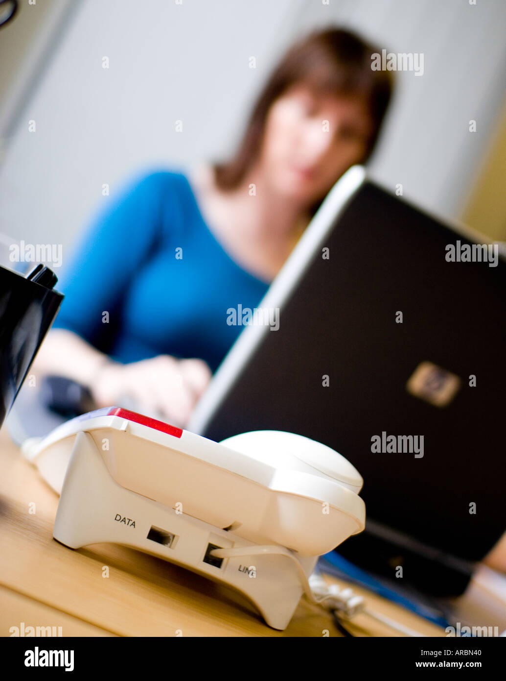 Women in office working on laptop Stock Photo