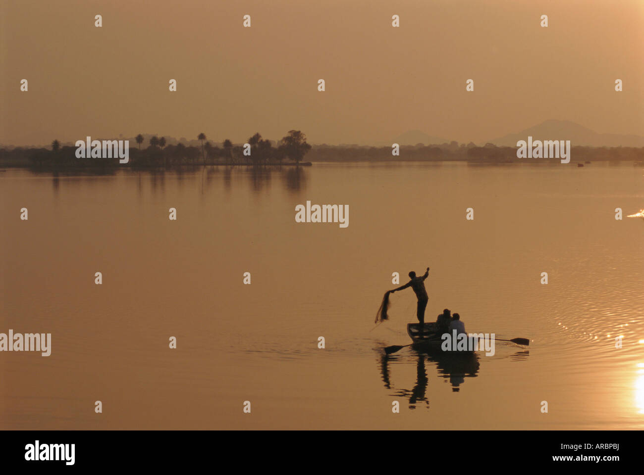 Sunset over lake created by dam, Deogarh, Rajasthan, India Stock Photo