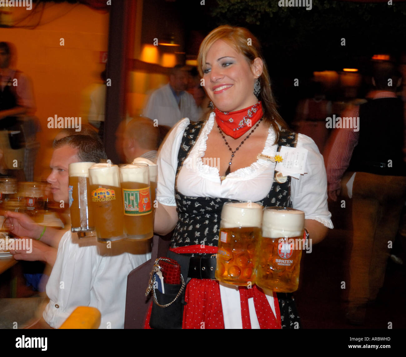 Oktoberfest waitress carrying beers Stock Photo - Alamy