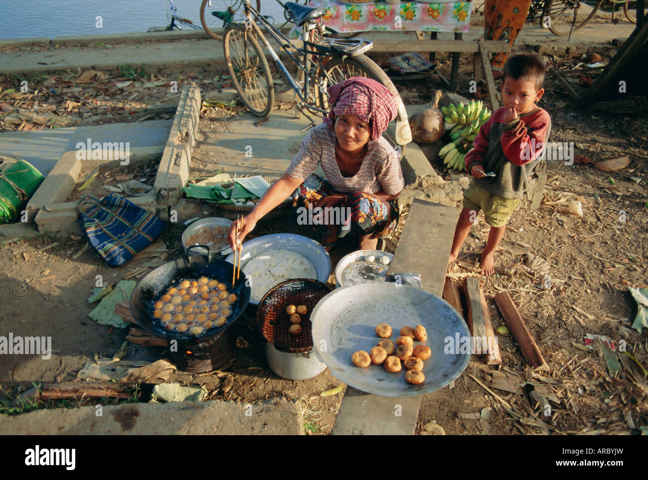 Woman selling bananas and rice balls, Cambodia, Indochina, Asia Stock Photo